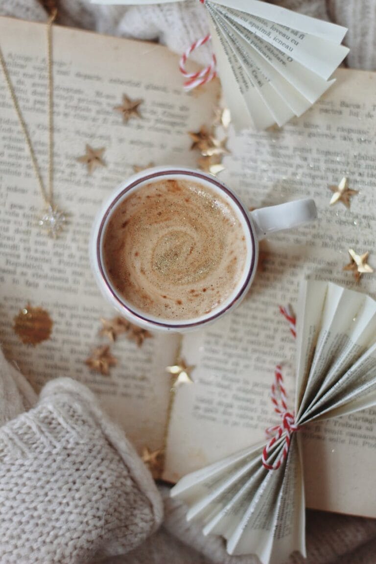 cup of hot chocolate on an open book